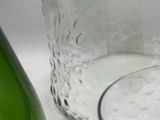 a glass of water next to a bottle of wine