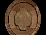 a picture of a stone in the middle of a wooden barrel