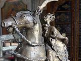 a statue of a man riding a horse with a woman on it