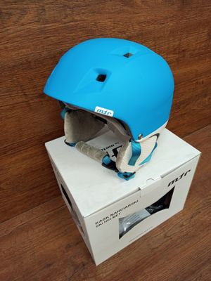 an image of a blue helmet sitting on top of a cardboard box