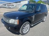 a picture of a black land rover parked in a parking lot
