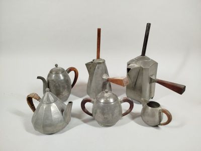 five different types of silver teapots and a coffee pot