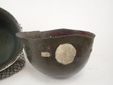 a bowl and a bowl with a spoon on a table