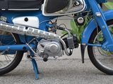 a blue motorcycle parked on the side of the road