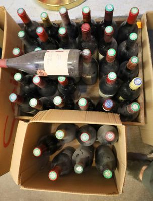 many bottles of wine in a box on the floor