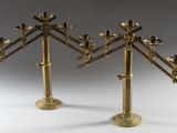 pair of brass candlesticks with candles in the shape of a tree