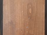 an image of a wooden easel with a piece of wood on it