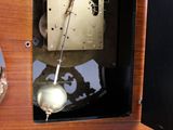 a clock that is sitting on a table with a clock on it