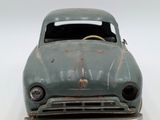 a toy car that is sitting on a white surface