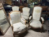 four chairs that are sitting next to each other in a room
