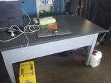 a computer desk with a keyboard and a mouse on it