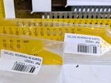 two yellow rulers and a ruler on a table