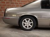 an image of a silver car parked in a garage