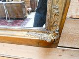 a man taking a picture of himself in a mirror
