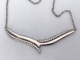 an image of a silver necklace with diamonds on a white background