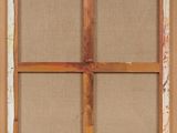 an old window with a wooden frame and a brown cloth covering it