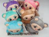 five stuffed animals sitting in a box together