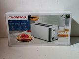 boxed picture of a toaster sitting on top of a counter
