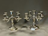 pair of silver plated candelabs with candlesticks on stands