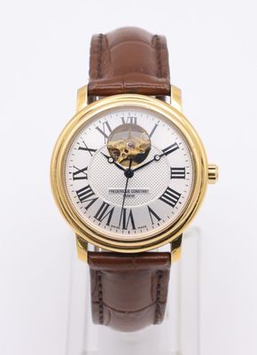 an image of a close up of a wrist watch with roman numerals