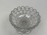 a clear glass bowl with a decorative design on it