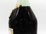 an image of a bottle of liquor sitting on top of a table