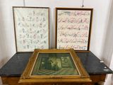 two framed pictures sitting on a table next to each other