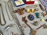 a lot of jewelry sitting on a tray on a table