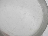 a close up of a white plate on a table