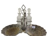 a silver plate with two bowls and a bottle on it