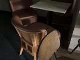 two chairs and a table in a small room