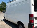 a white van that is parked in a parking lot