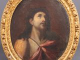 a painting of a man with a crown on his head in a gold frame