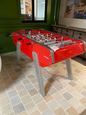 a foosball table in the corner of a room