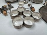 a lot of silver items on the table