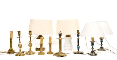 four lamps that are sitting next to each other on a table