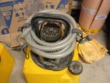 a yellow box with a gray hose and a yellow box with a yellow hose