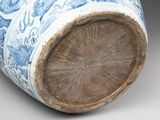 a blue and white vase sitting on a table