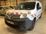a white van with red and white stripes parked in a garage