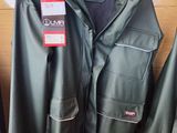 two jackets hanging on a rack in a store