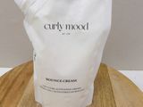 a close up of a bottle of cream on a wooden table
