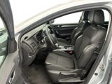 the interior of a car with the door open and the driver ' s seat down