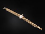 an 18k gold bracelet watch with a diamond