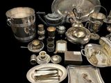 a lot of silver items that are on a table