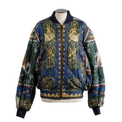 a blue and green jacket with a pattern on the front