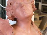 a statue of a woman that is sitting on a table