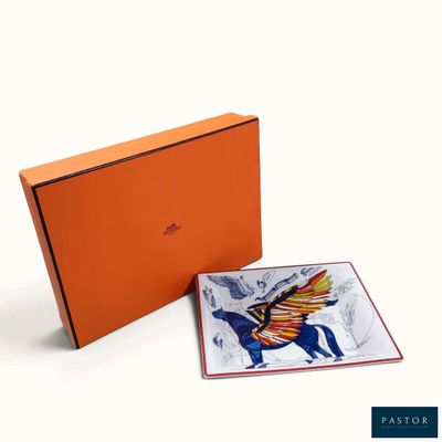 an orange box with a picture of a horse and a bird on it