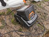 a black and white photo of a battery on the ground
