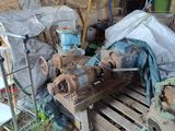 a pile of junk sitting on a pallet next to a building