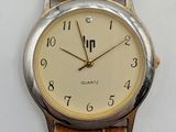an image of a close up of a wrist watch on a white surface